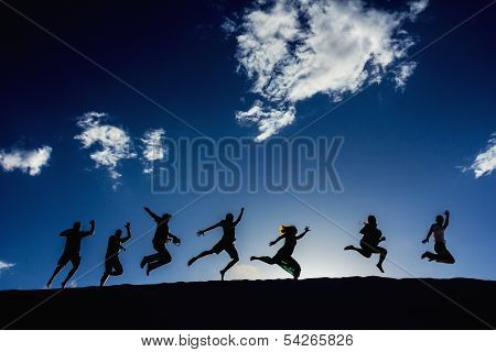 Silhouettes Of Jumping People