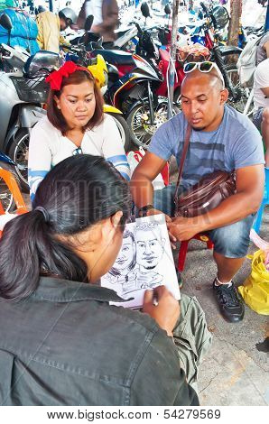 Thai Painter Draws Picture For The Tourists In Chatuchak Market