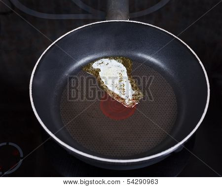 Small Piece Dairy Butter Melting On Pan