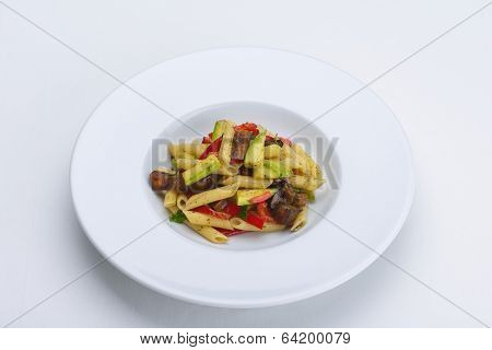 Pasta with shrimps, herbs and mashrooms isolated on white background in studio