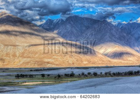 High dynamic range image valley in Himalayas. with sand dunes. Hunder, Nubra valley, Ladakh, India