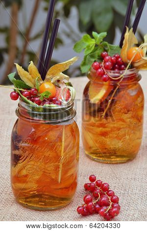 Cocktail alcoholic drinks and fruits.