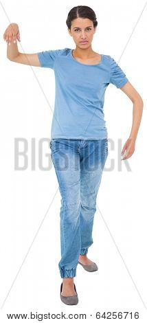 Powerless brunette in jeans and tshirt on white background