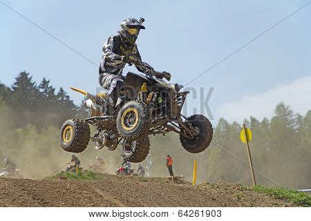 Quad Racer With Camera On Helmet Is Jumping