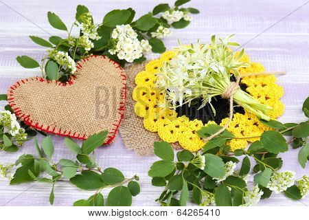 Beautiful spring wildflowers, on wooden background