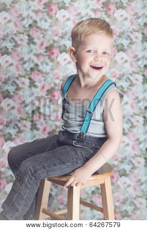 Portrait of funny little boy laughing
