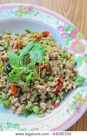 Rice topped with stir-fried pork and basil