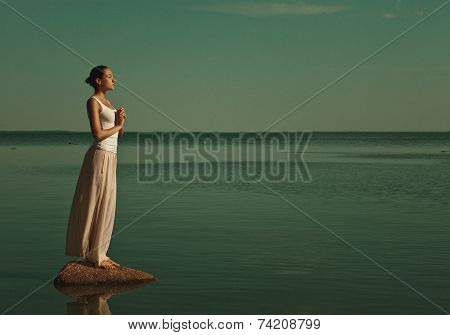 woman meditating in a yoga pose