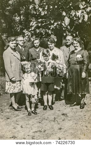 POLAND, CIRCA FIFTIES: Vintage photo of big family with children at First Communion of little boy