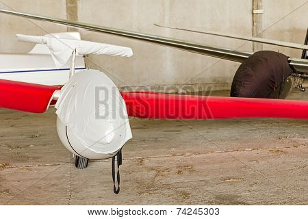Lightweight Gliders Stationed Inside Of A Big Hangar