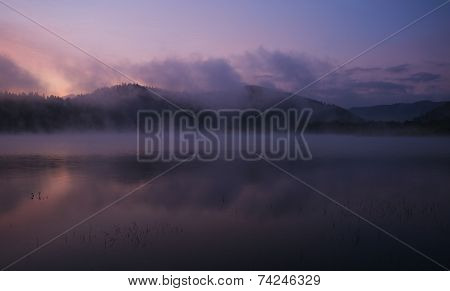 Fog at dawn over Lake Solina in the Bieszczady