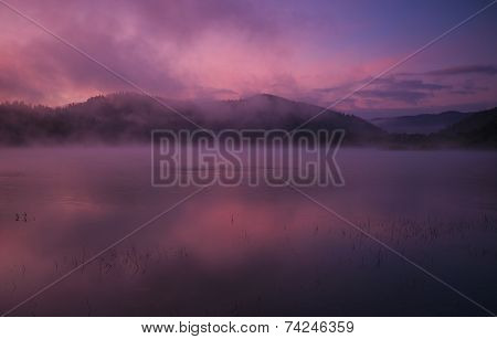 Fog at dawn over Lake Solina in the Bieszczady Mountains