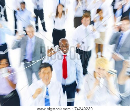 Business People Communicating Via Tin Can Phone
