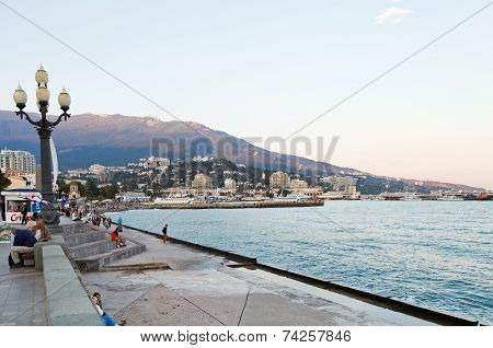 Tourists On Waterfront In Yalta City In Evening