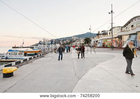 Tourists On Promenade In Yalta City In Evening
