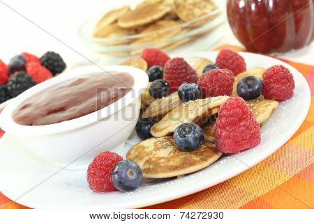 Poffertjes With Berries And Icing Sugar
