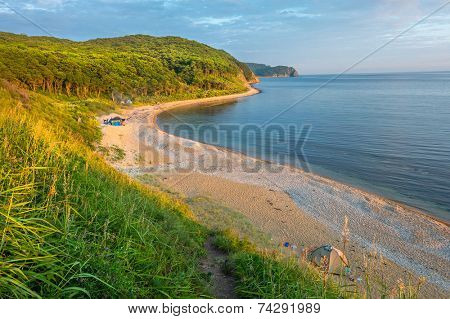 sunset camping view on the beach of russian isle Putyatin 