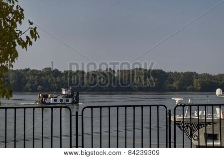 Tugboat pass along the Ruse port at Danube river