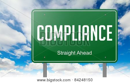 Compliance on Green Highway Signpost.