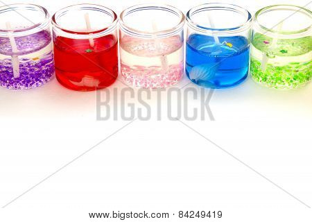 Candles In Glass Horizontally On Top Of The White