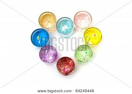 Candles In Glass In The Form Of Heart On A White Background