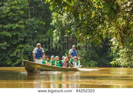 Cuyabeno, Ecuador - 20 March 2015: European Biologists Exploring The Marvels Of The Amazon Jungle Crossing Cuyabeno River, South America In Cuyabeno On March 20, 2015