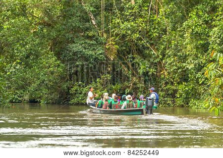 Cuyabeno, Ecuador - 20 March 2015: European Biologists In The Canoe Crossing Cuyabeno River In Cuyabeno On March 20, 2015
