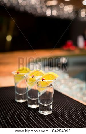 Three Tequila Shots With Lemon