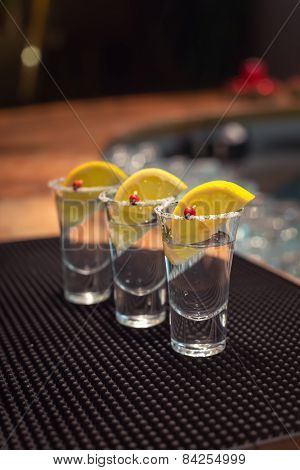 Three Tequila Shots With Lemon
