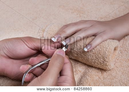 Manicure. Trimming the cuticle