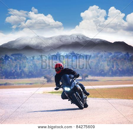 Young Man Riding Motorcycle On Asphalt Road Against Mountain Highways Background Use For People Acti