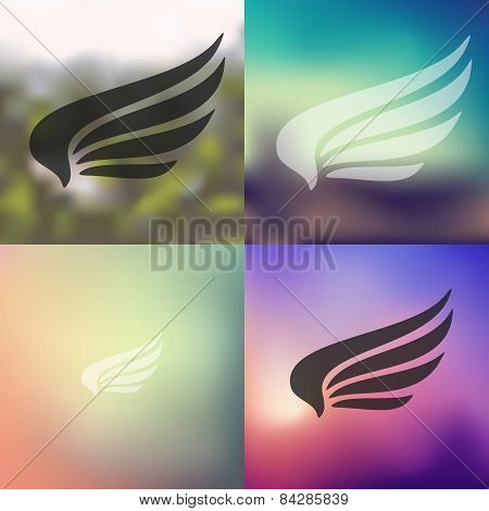 wing icon on blurred background