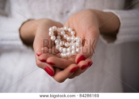 Pearls In Female Hands