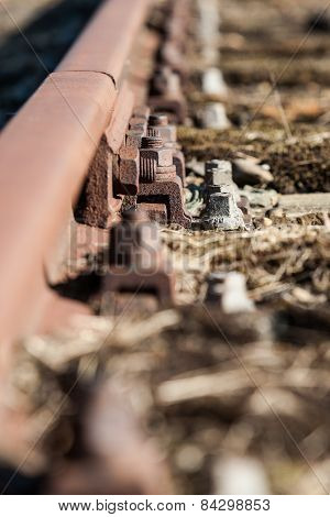 Old And Lost Railroadtrack With Nut And Bolt