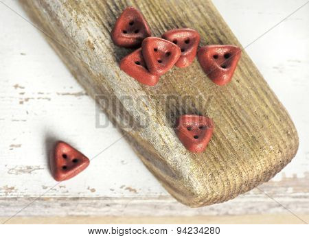 Handmade Triangle Buttons On Aged Wooden Board, Wabi-sabi Style Still Life