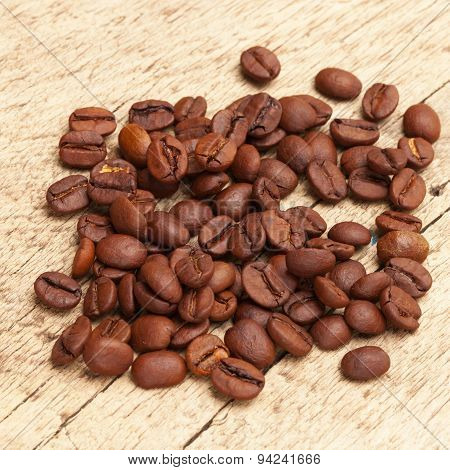Coffee Beans Over Old Wooden Table