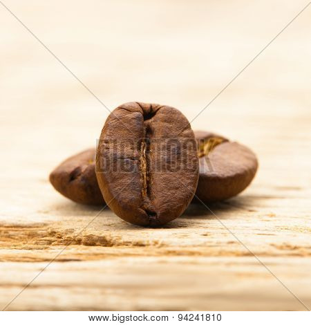 Coffee Beans On Old Wooden Table - Close Up Shot