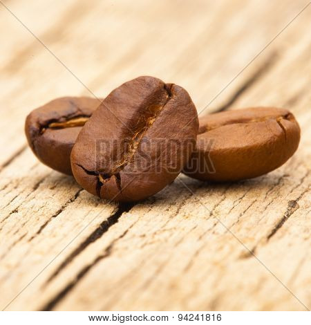 Coffee Beans On Wooden Table - Close Up Shot