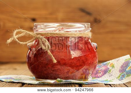 Homemade Strawberry Jam In Glass Jar With Hempstring On Paper Napkin