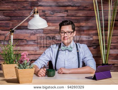 Lesbian In Stylish Office At Wood Desk