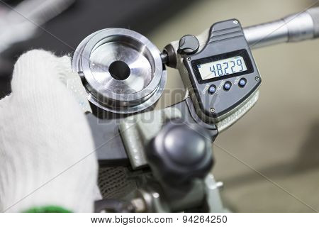 Operator Inspection Automotive Part By Micrometer