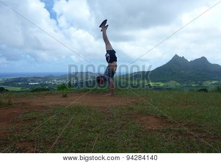 Man Handstands At Pali Highway Lookout Point