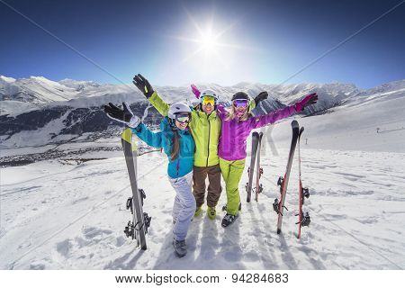 Smiling girl in blue jacket skiing alps resort