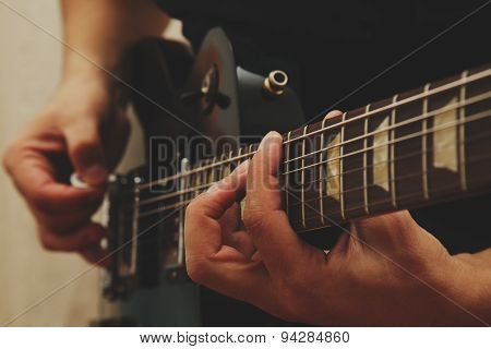 Man playing on guitar