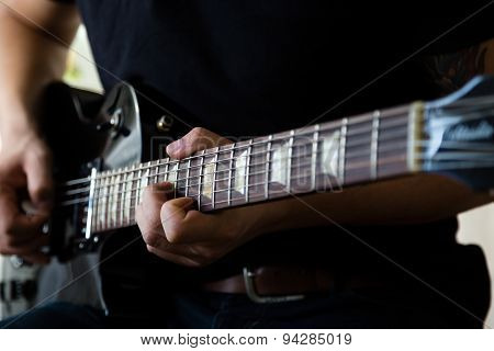 Man playing on guitar