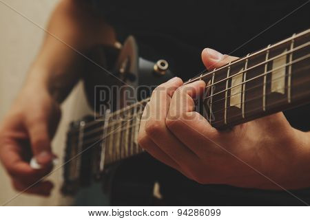 Man playing on guitar