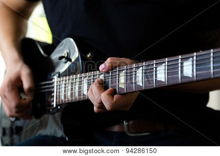 Man playing on guitar