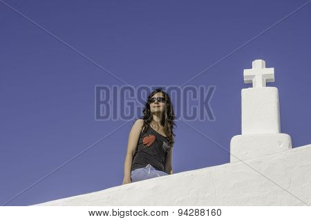 Girl And Cross With Blue Background.