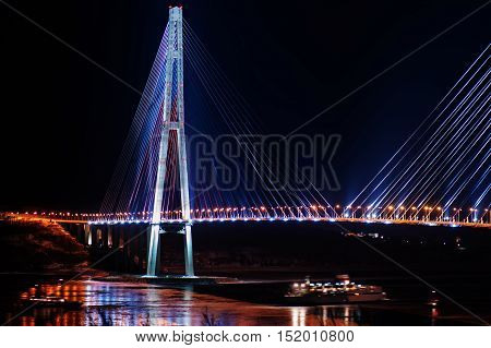 night view of the longest cable-stayed bridge in the world in the Russian Vladivostok over the Eastern Bosphorus strait to the Russky Island