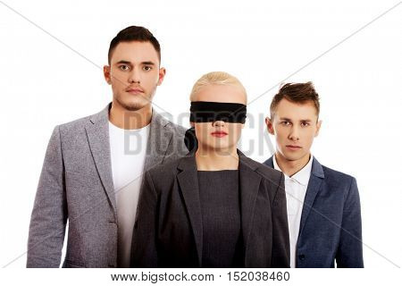 Business team-two man and blindfolded woman